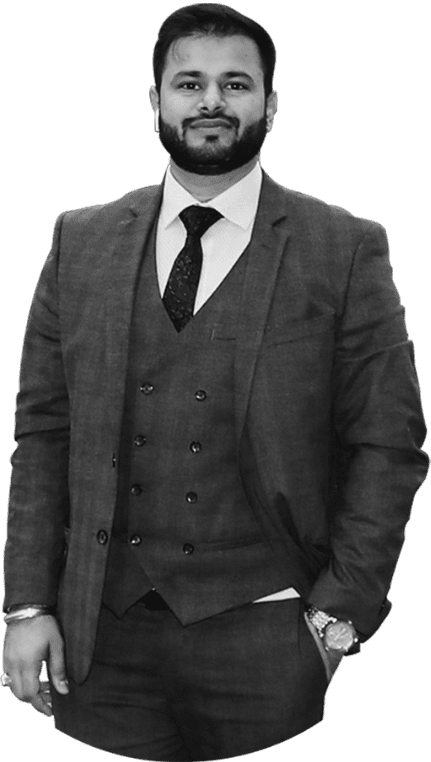 A person, name Amratpal singh Sohal, is German Education Consultants. He is in a black suit and a tie, stands smiling with his hand in his pocket. With practical experiences, he is capable of mentoring students with the best. He has B2-level German Proficiency and a Bachelor of Environmental and Resource Management (ERM).